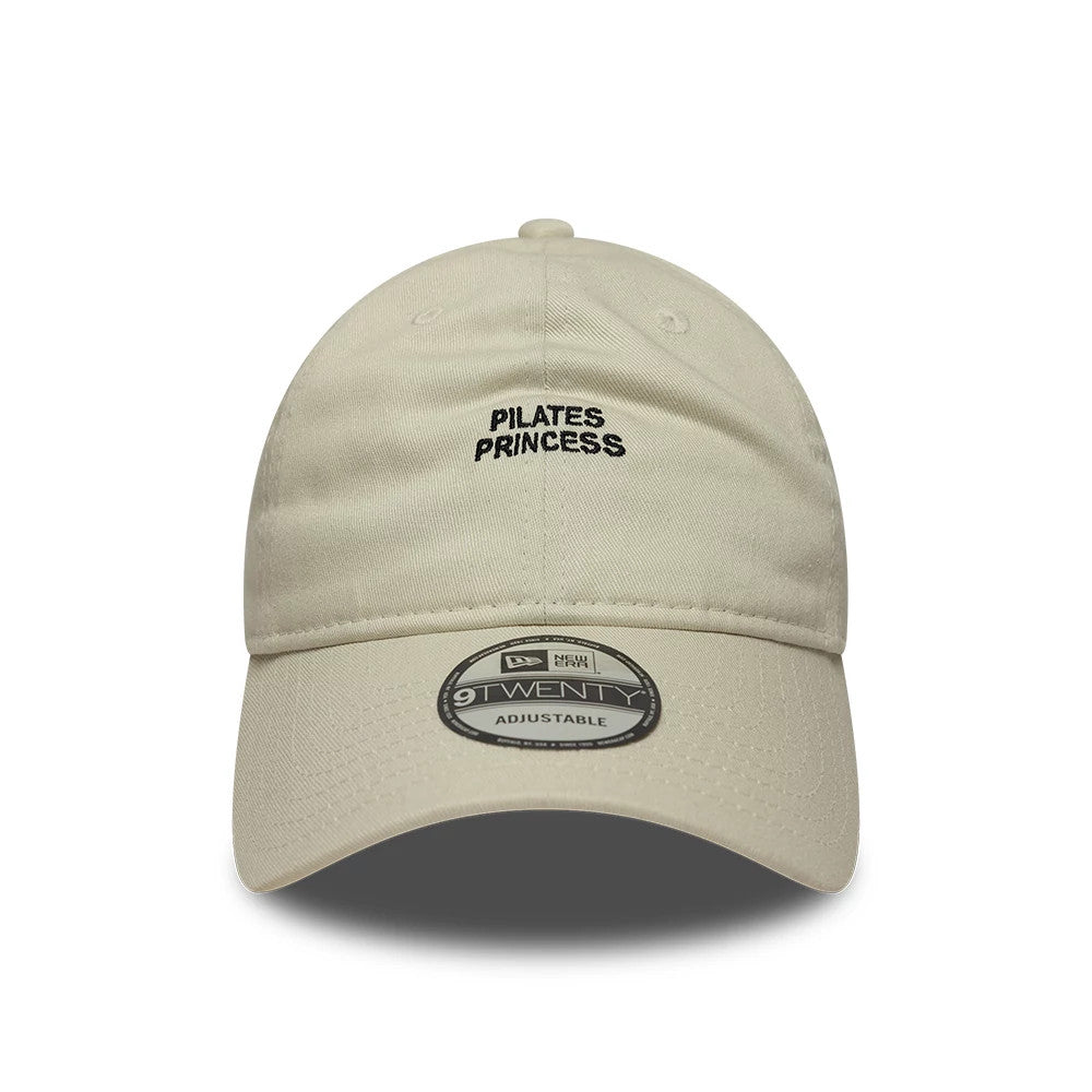 New Era Slogan Pilates Princess Light Beige 9TWENTY Adjustable Cap, front view showing black embroidered text on the unstructured crown, with a curved visor and 9TWENTY size sticker on the visor.