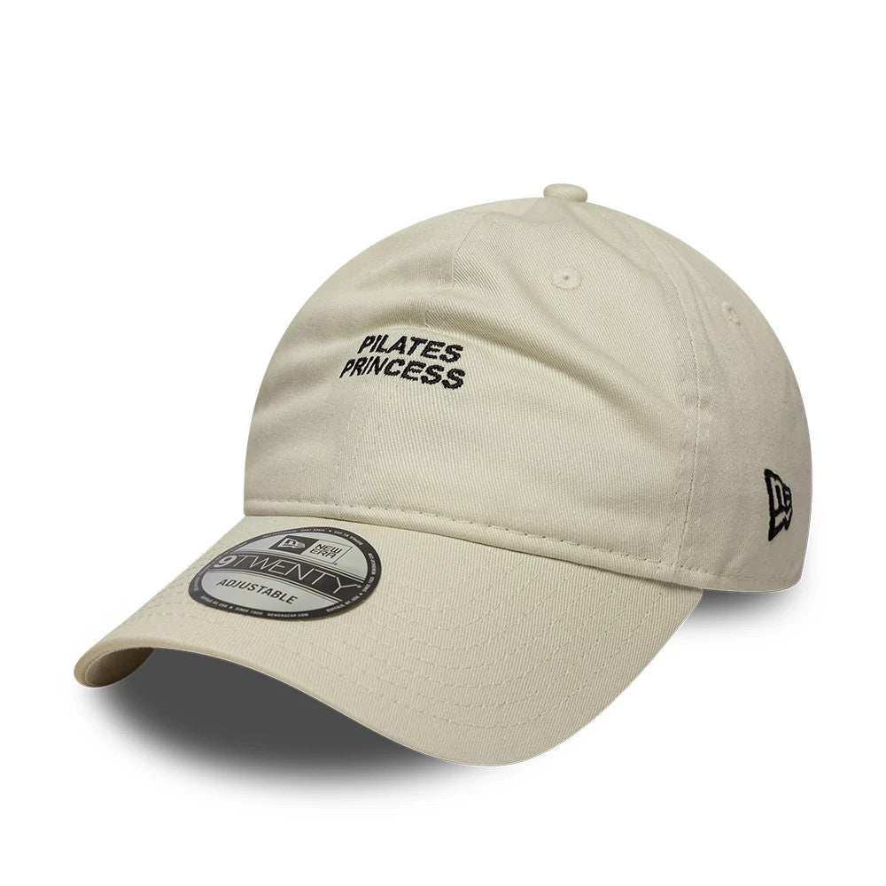 This is a  New Era Slogan Pilates Princess Light Beige 9TWENTY Adjustable Cap 1