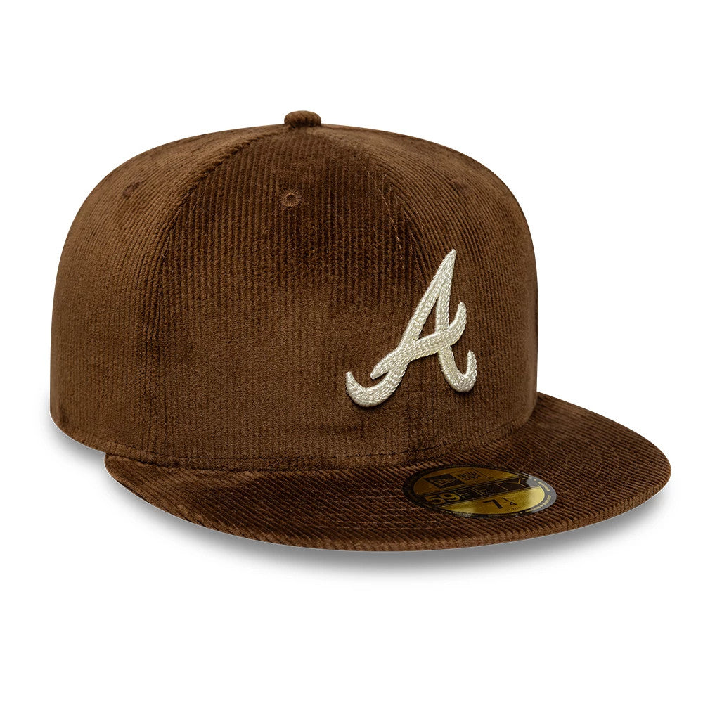 Atlanta Braves MLB Cord Dark Brown New Era 59FIFTY Fitted Cap, three-quarter view showing the raised white A logo on the brown corduroy front panel and a gold 59FIFTY size sticker on the flat visor.