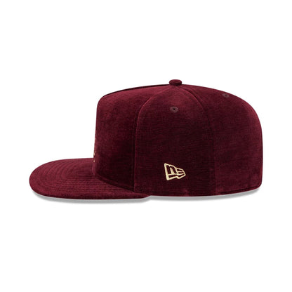 Pictured is this New Era Holiday Essentials 9FIFTY A-Frame Snapback cap in dark purple. 6