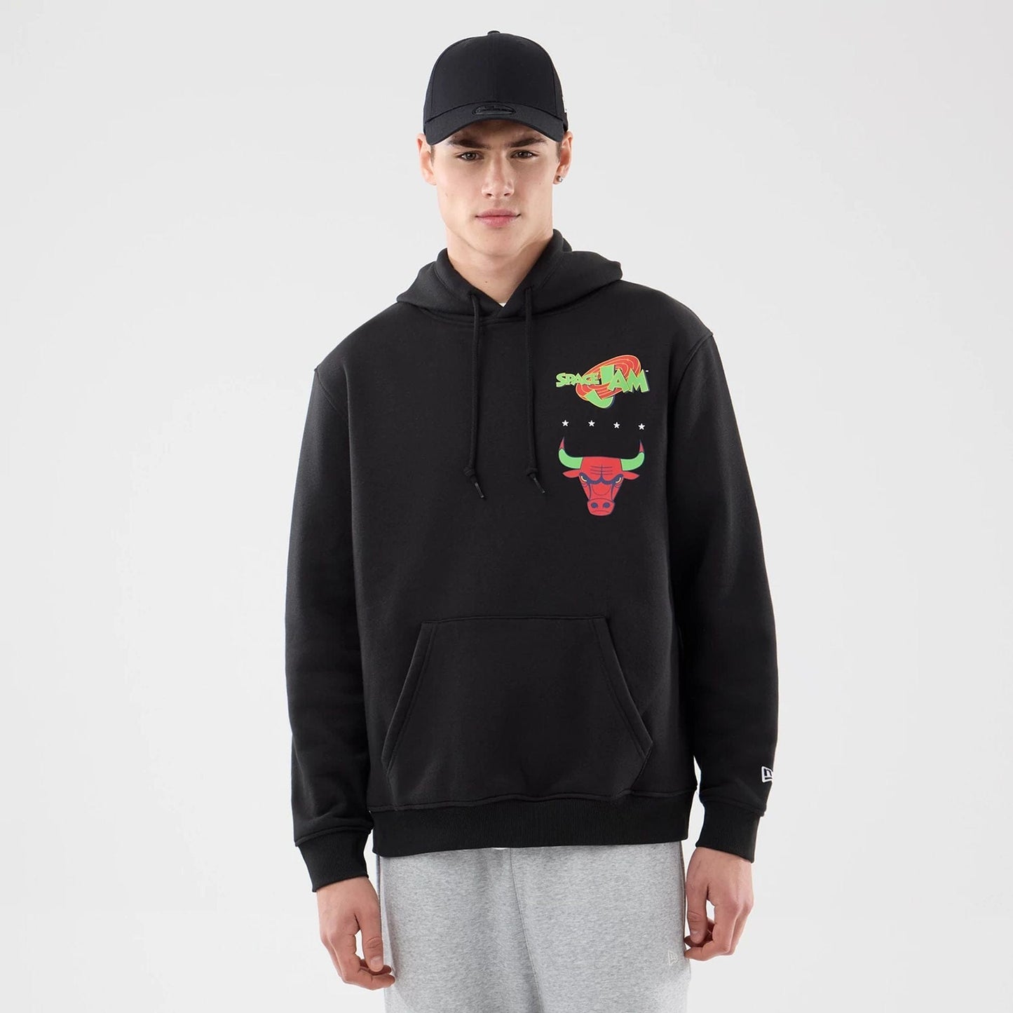 The model is wearing this Space Jam 2 X NBA Chicago Bulls Pullover Hoodie in black. 1