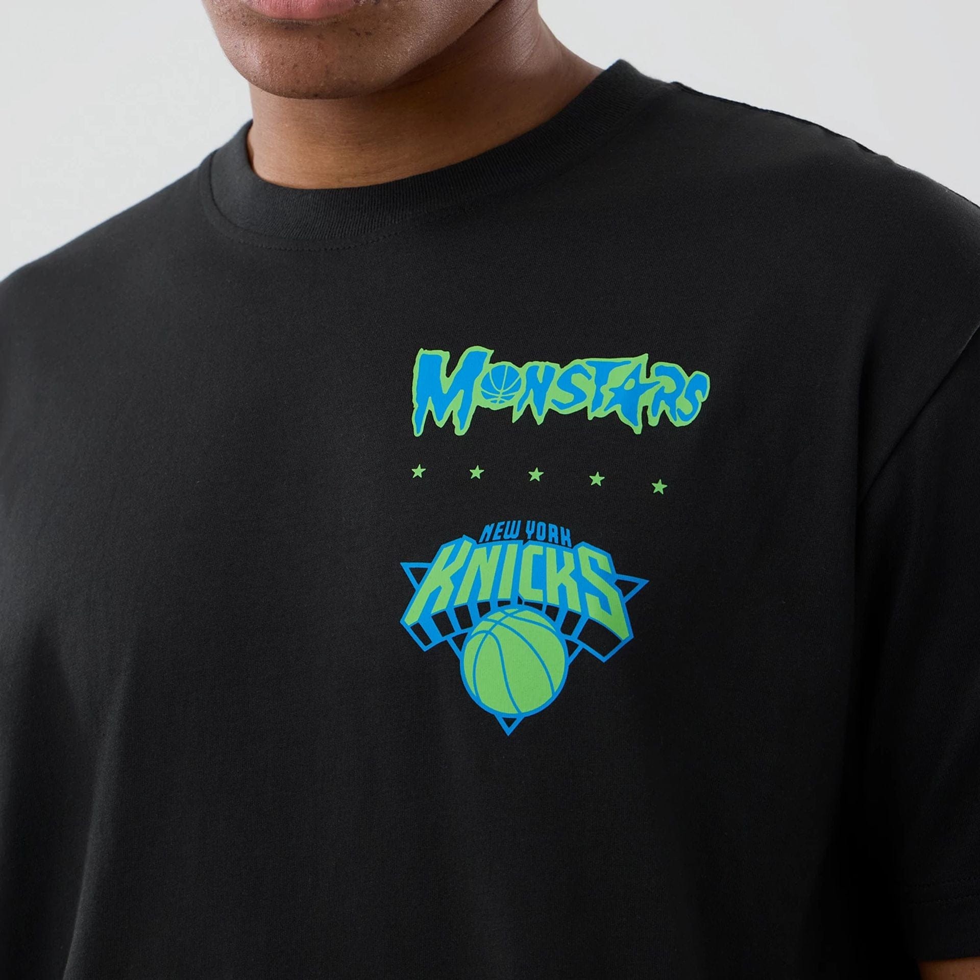 The model is wearing this Space Jam 2 X NBA New York Knicks T-Shirt in black. 3