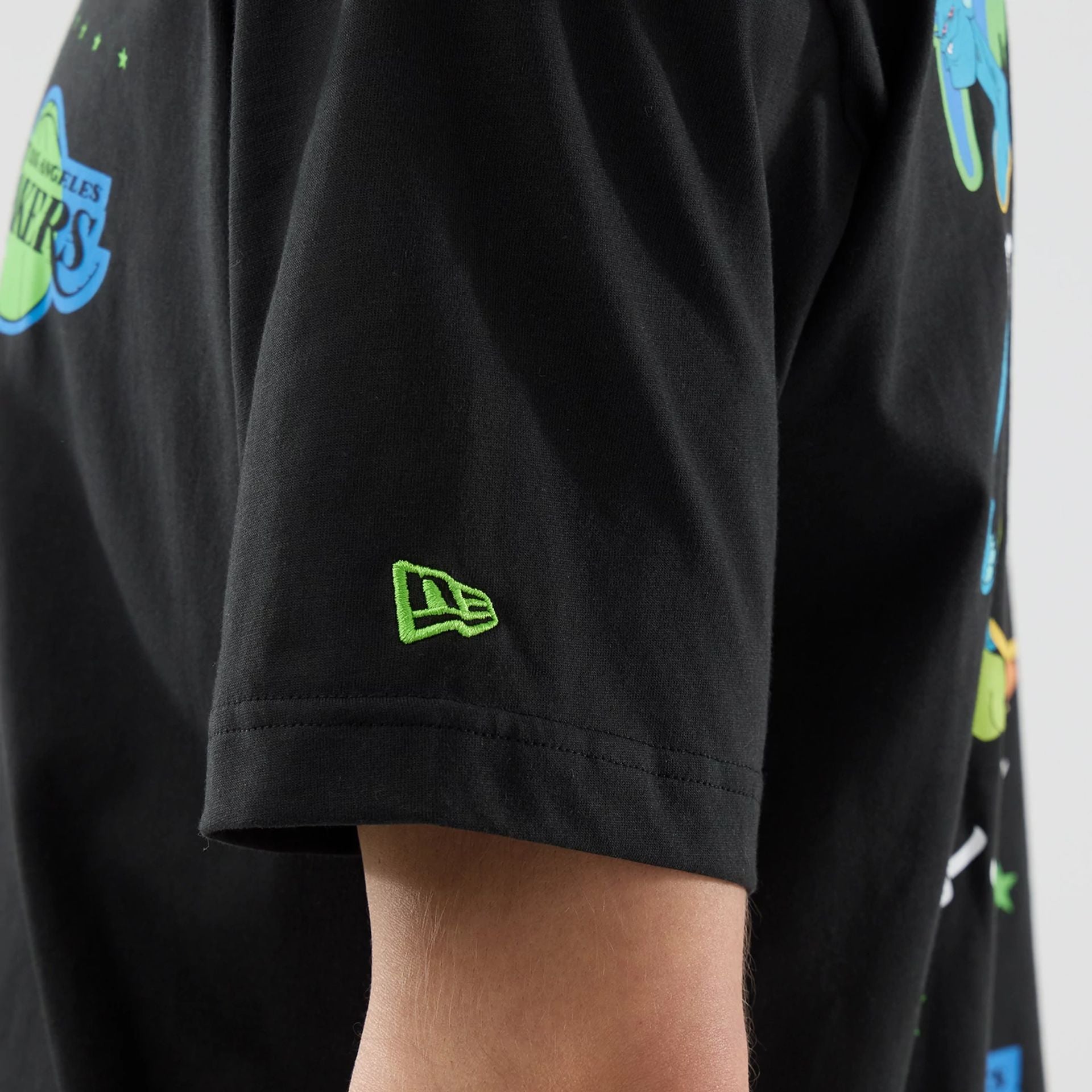 The model is wearing this Space Jam 2 X NBA LA Lakers T-Shirt in black. 6