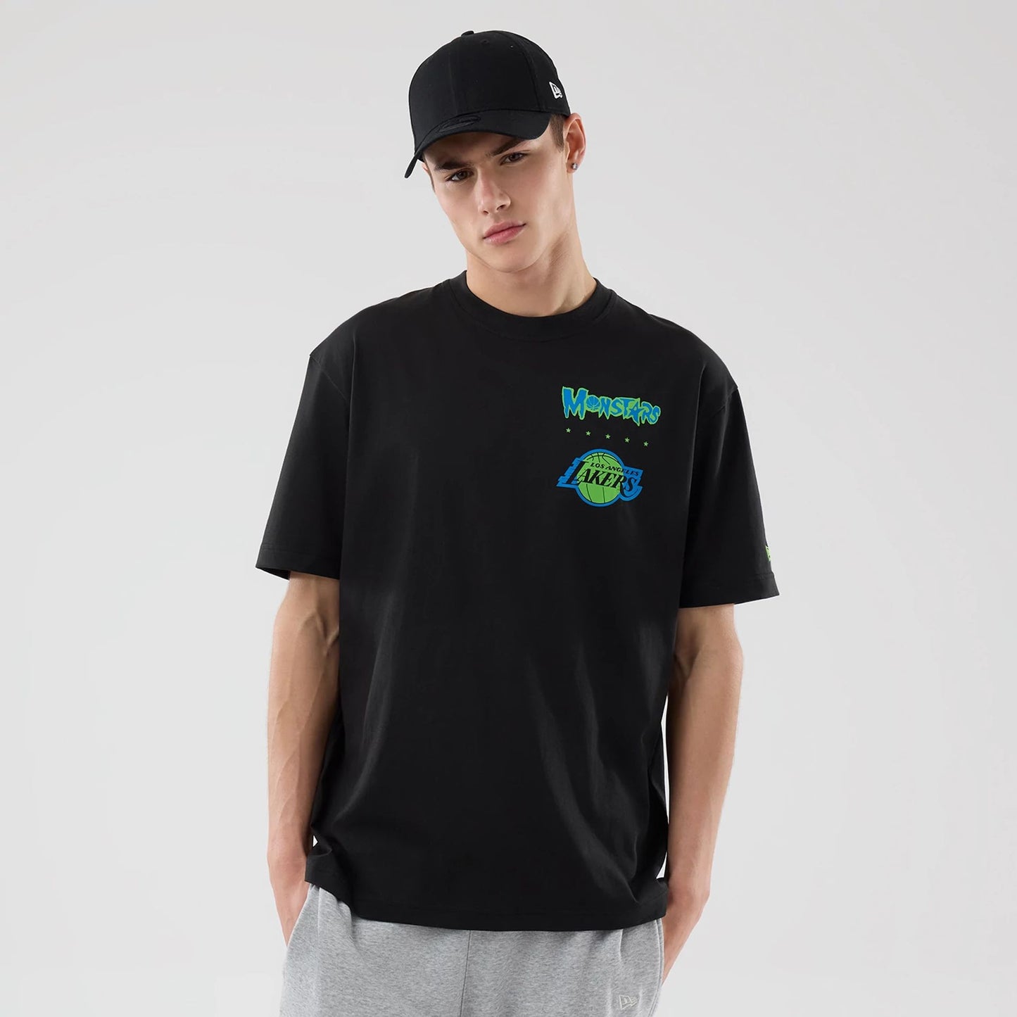 The model is wearing this Space Jam 2 X NBA LA Lakers T-Shirt in black. 1