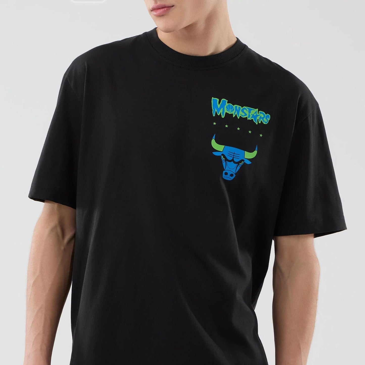 The model is wearing this Space Jam 2 X NBA Chicago Bulls T-Shirt in black. 3