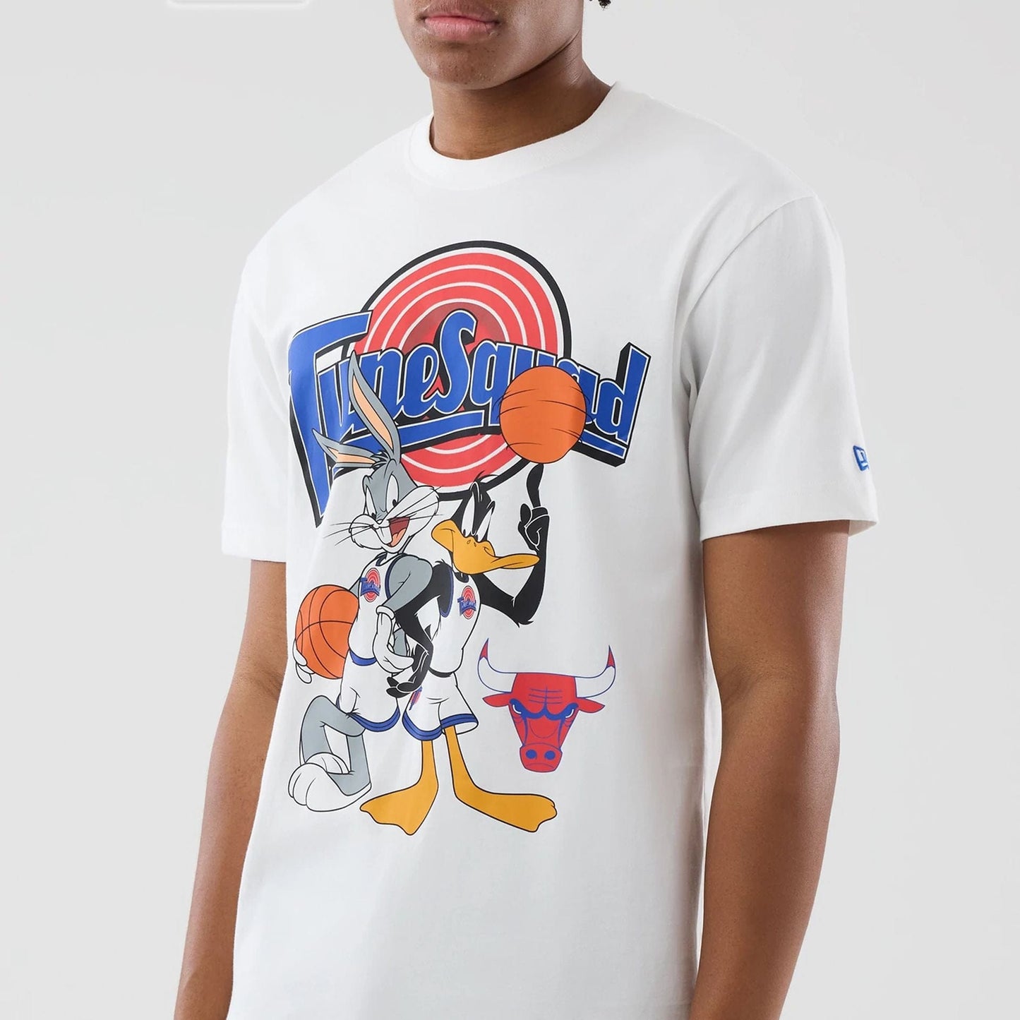 The model is wearing this Space Jam 2 X NBA Chicago Bulls T-Shirt in white. 3