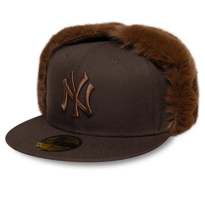 New York Yankees MLB World Series Dark Brown Dogear New Era 59FIFTY Fitted Cap, front view showing raised brown NY logo embroidery on the front panel, flat visor visor with a gold 59FIFTY size sticker, and dark brown faux fur dogears.