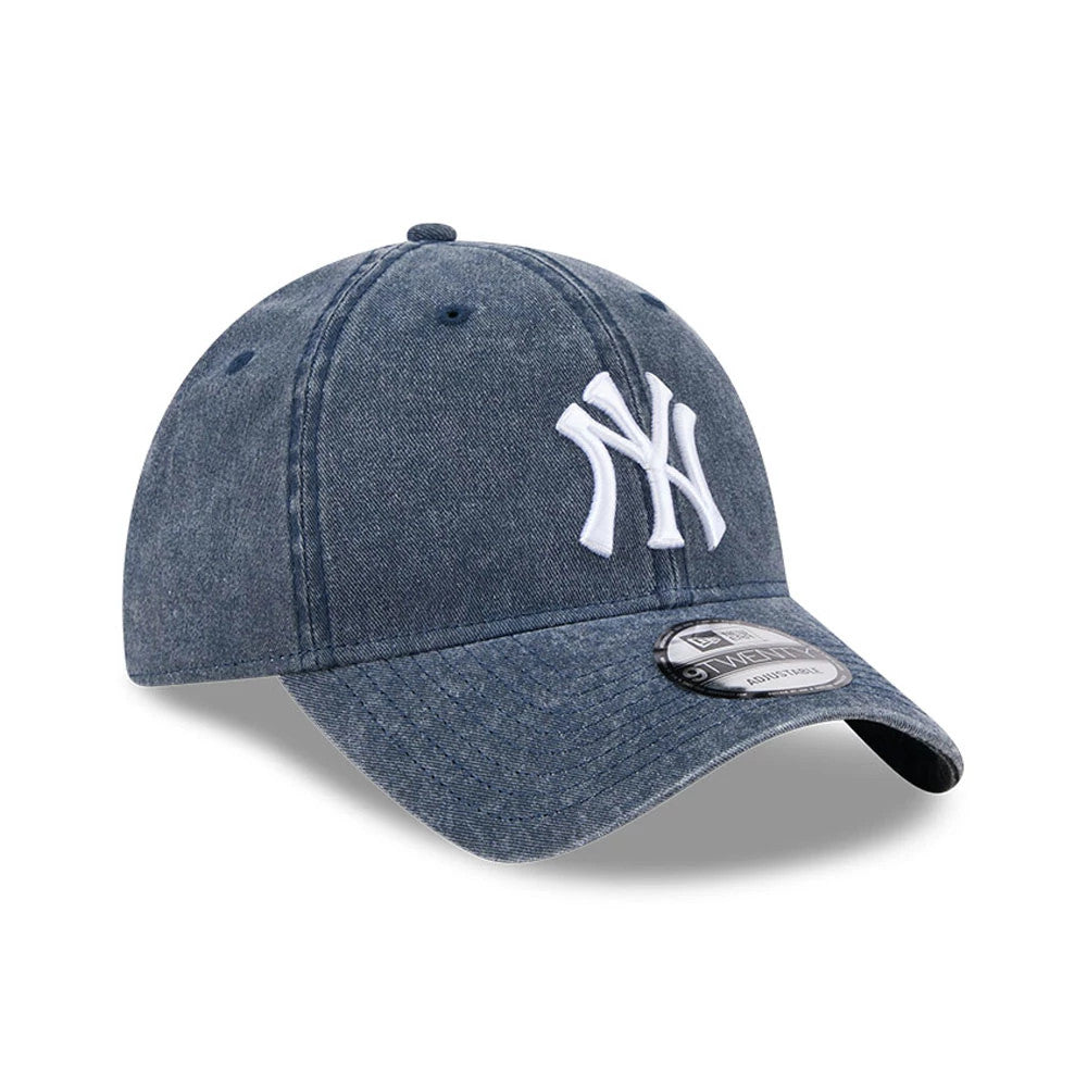 New York Yankees MLB Overwash Dark Blue New Era 9TWENTY Adjustable Cap, three-quarter view showing the white raised embroidered NY logo on the front panel, curved dark blue visor, and 9TWENTY size sticker on the visor.