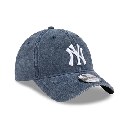 New York Yankees MLB Overwash Dark Blue New Era 9TWENTY Adjustable Cap, three-quarter view showing the white raised embroidered NY logo on the front panel, curved dark blue visor, and 9TWENTY size sticker on the visor.