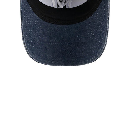 New York Yankees MLB Overwash Dark Blue New Era 9TWENTY Adjustable Cap, inside view showing the white cotton sweatband and the New Era logo on the taped seams, with a dark blue undervisor contrasting with the black interior panels.