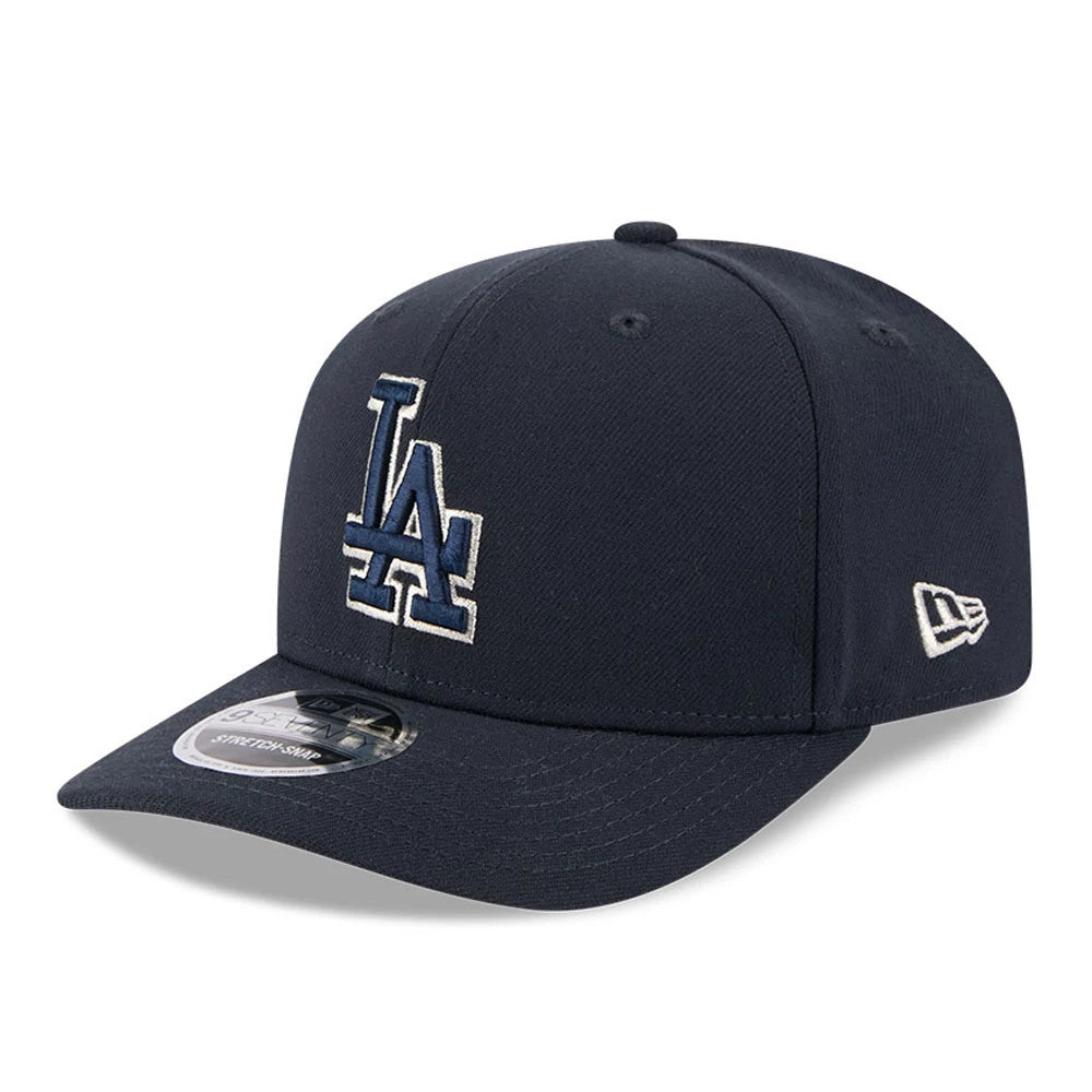 LA Dodgers MLB Navy New Era 9SEVENTY Stretch Snap Adjustable Cap, front view showing the raised blue and white embroidered LA logo on the front panel, with a curved visor and a 9SEVENTY size sticker.