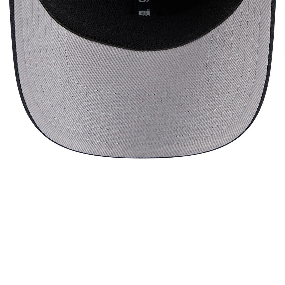 LA Dodgers MLB Navy New Era 9SEVENTY Stretch Snap Adjustable Cap, inside view showing the grey undervisor with detailed stitching and black interior taping, highlighting the adjustable snap closure on the structured navy crown.