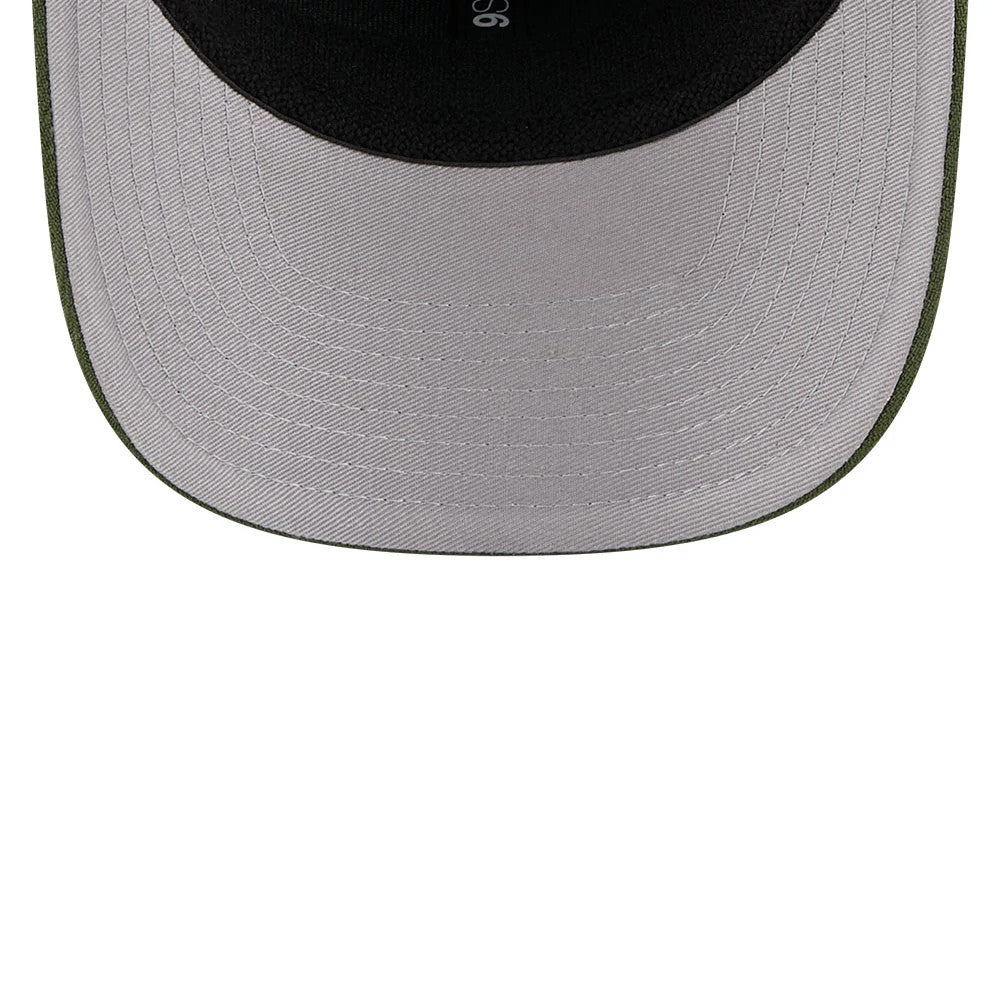 Pictured is this New Era Flawless 9SEVENTY Stretch Snap cap in dark green. 2