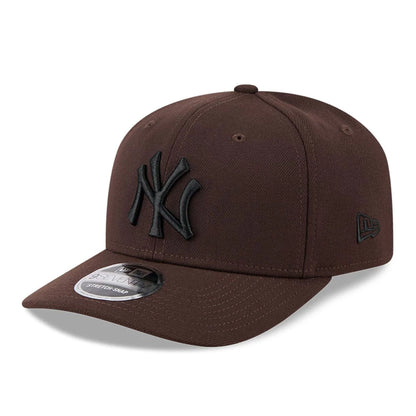 Pictured is this MLB New York Yankees 9SEVENTY Stretch Snap cap in dark brown. 1