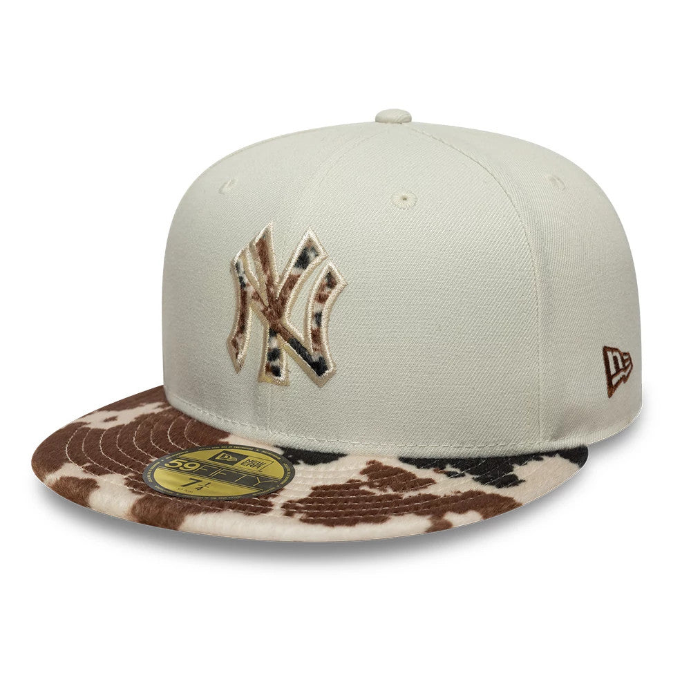 New York Yankees Animal Print Beige New Era 59FIFTY Fitted Cap, front view showing raised New York Yankees logo in beige and black embroidery on the front panel, brown and cream animal print flat visor and gold 59FIFTY size sticker.
