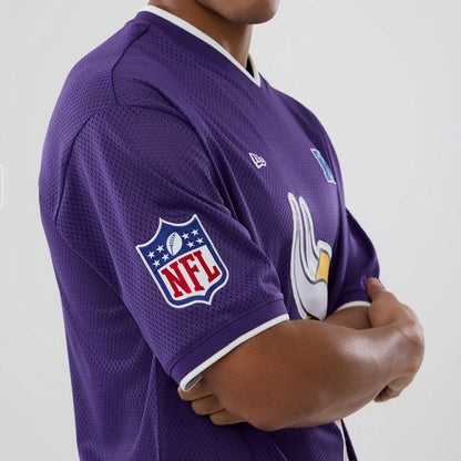 The model is wearing this NFL Mesh Minnesota Vikings Oversized T-Shirt in purple. 3