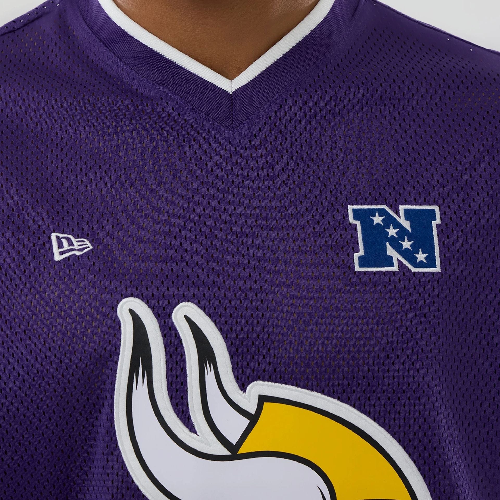 The model is wearing this NFL Mesh Minnesota Vikings Oversized T-Shirt in purple. 5