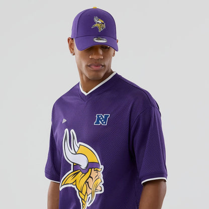 The model is wearing this NFL Mesh Minnesota Vikings Oversized T-Shirt in purple. 6