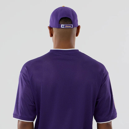 The model is wearing this NFL Mesh Minnesota Vikings Oversized T-Shirt in purple. 7
