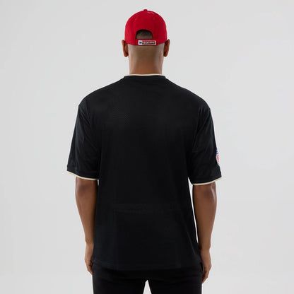 The model is wearing this NFL Mesh San Francisco 49ers Oversized T-Shirt in black. 2
