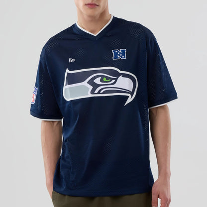 The model is wearing this NFL Mesh Seattle Seahawks Oversized T-Shirt in Navy. 4