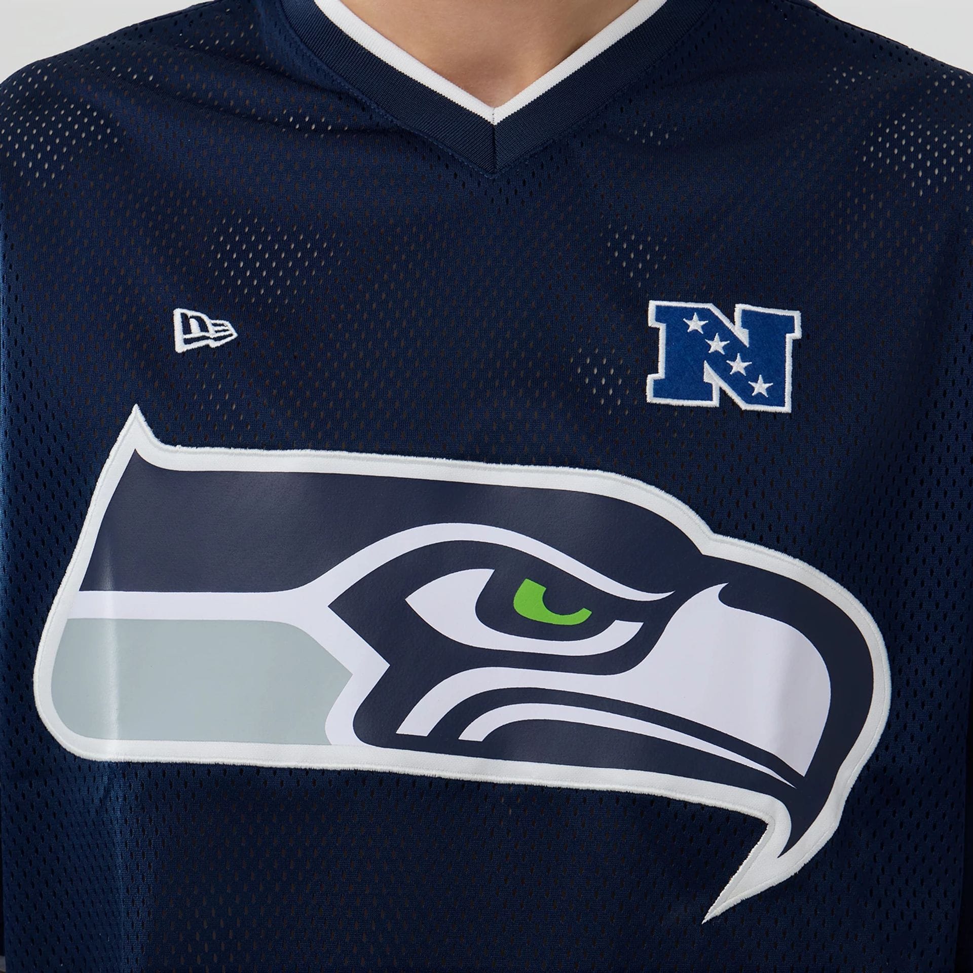 The model is wearing this NFL Mesh Seattle Seahawks Oversized T-Shirt in Navy. 5