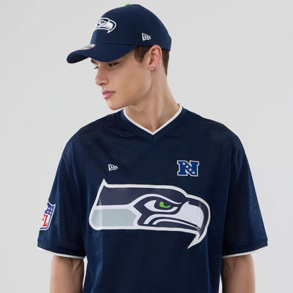 The model is wearing this NFL Mesh Seattle Seahawks Oversized T-Shirt in Navy. 6