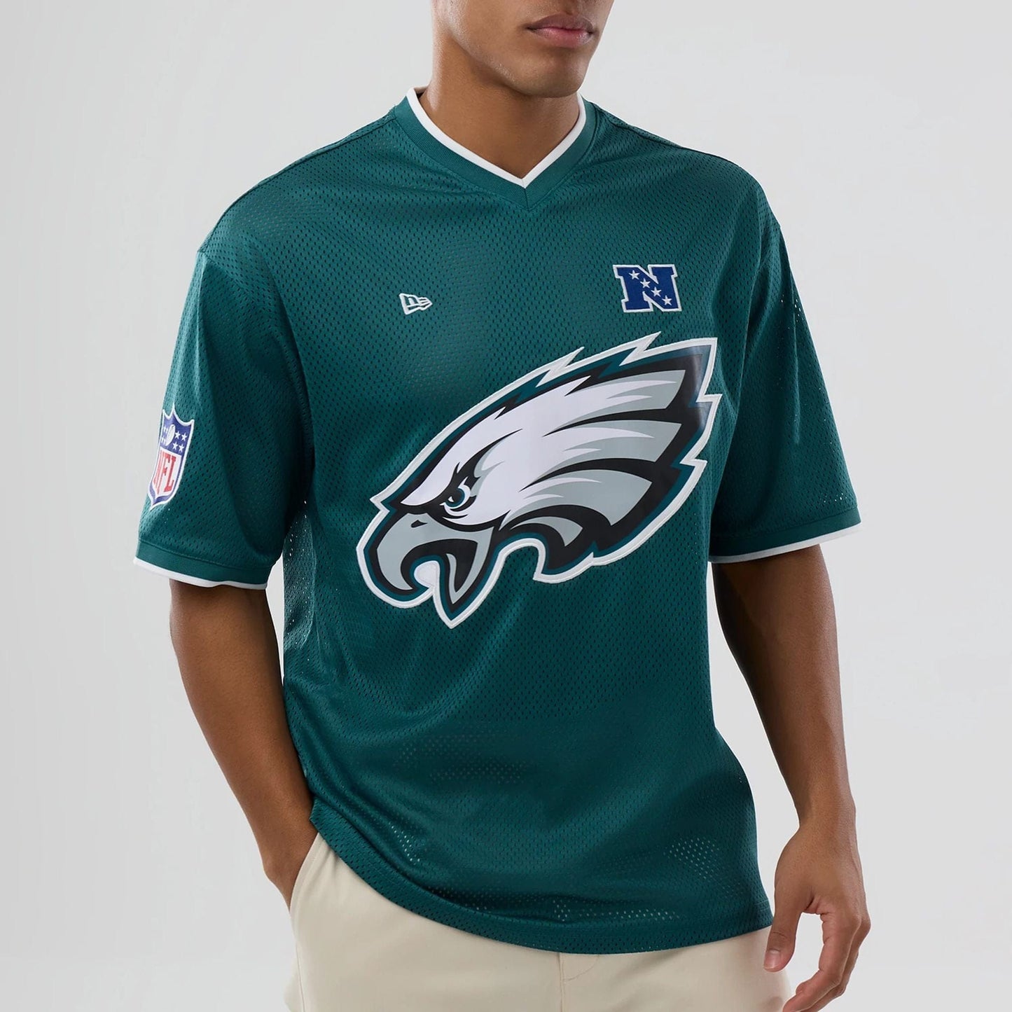 The model is wearing this NFL Mesh Philadelphia Eagles Oversized T-Shirt in dark green. 6