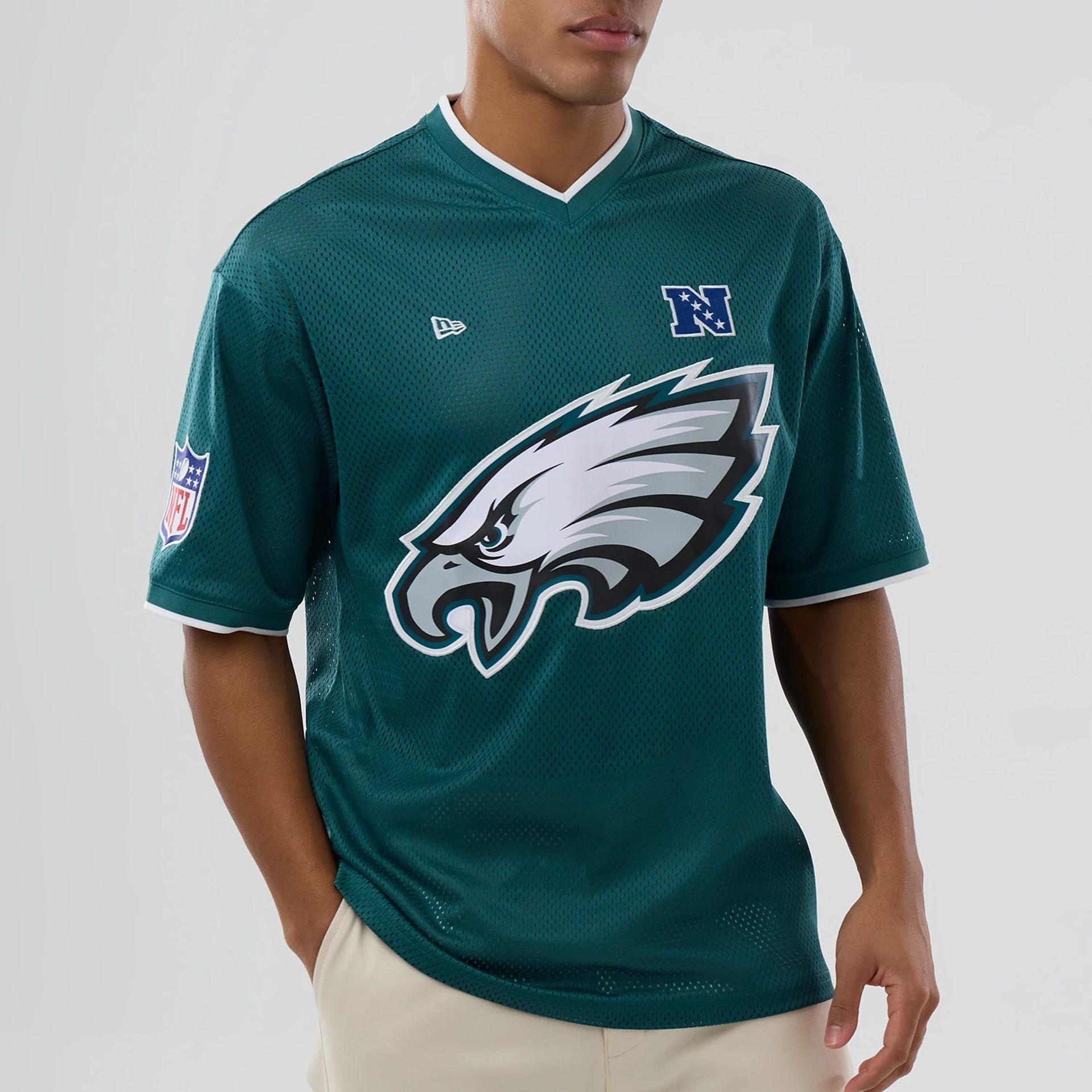 The model is wearing this NFL Mesh Philadelphia Eagles Oversized T-Shirt in dark green. 6
