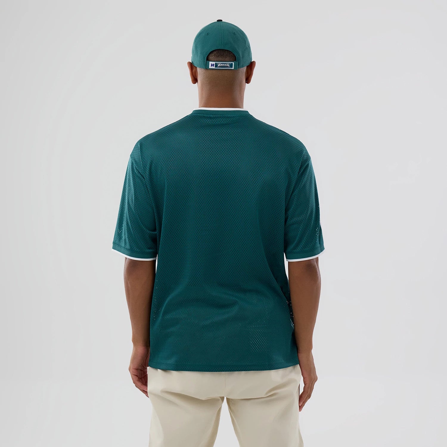 The model is wearing this NFL Mesh Philadelphia Eagles Oversized T-Shirt in dark green. 2