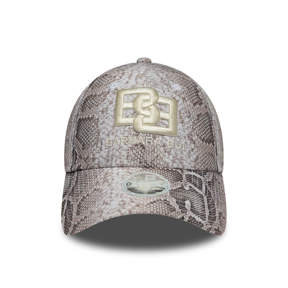 Womens New Era X Barbara Bui Python All Over Print 9FORTY Adjustable Cap, front view showing the gold embroidered Barbara Bui logo on the structured crown with a matching python print visor and a 9FORTY size sticker.