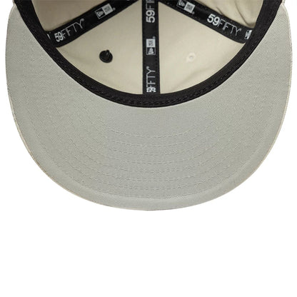Pictured is this New Era Winter Snowflakes 59FIFTY Fitted cap in light beige. 2