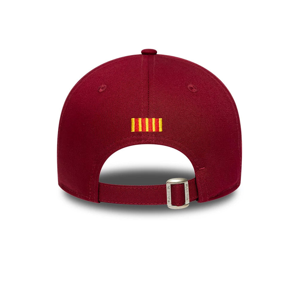 FC Barcelona Core Dark Red New Era 9FORTY Adjustable Cap, rear view showing the yellow and red striped embroidered logo on the back panels above the open adjustable strap with a buckle.