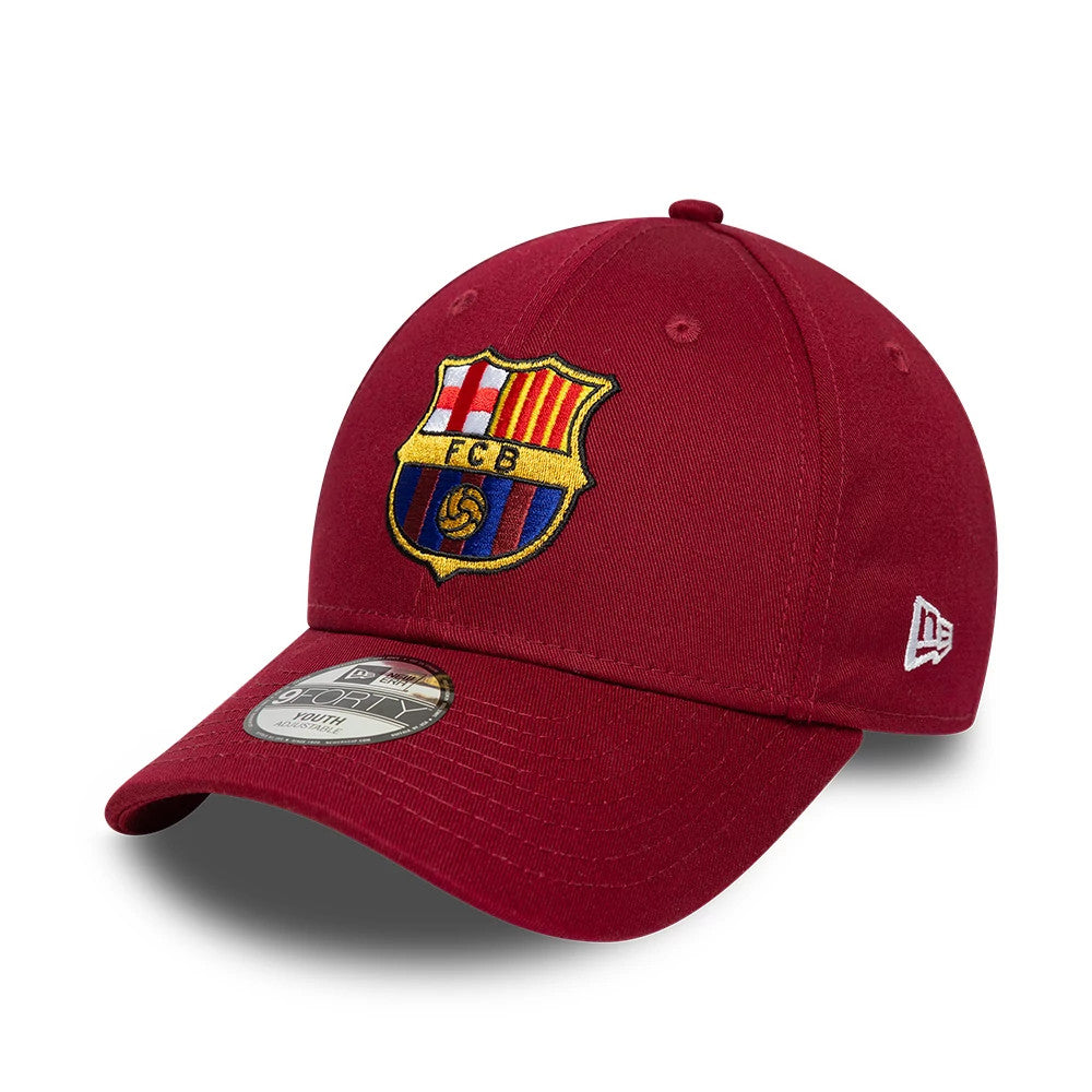 FC Barcelona Youth Core Dark Red New Era 9FORTY Adjustable Cap, three-quarter view showing the embroidered FC Barcelona crest on the structured dark red front panels, with a curved visor and a 9FORTY size sticker on the visor.