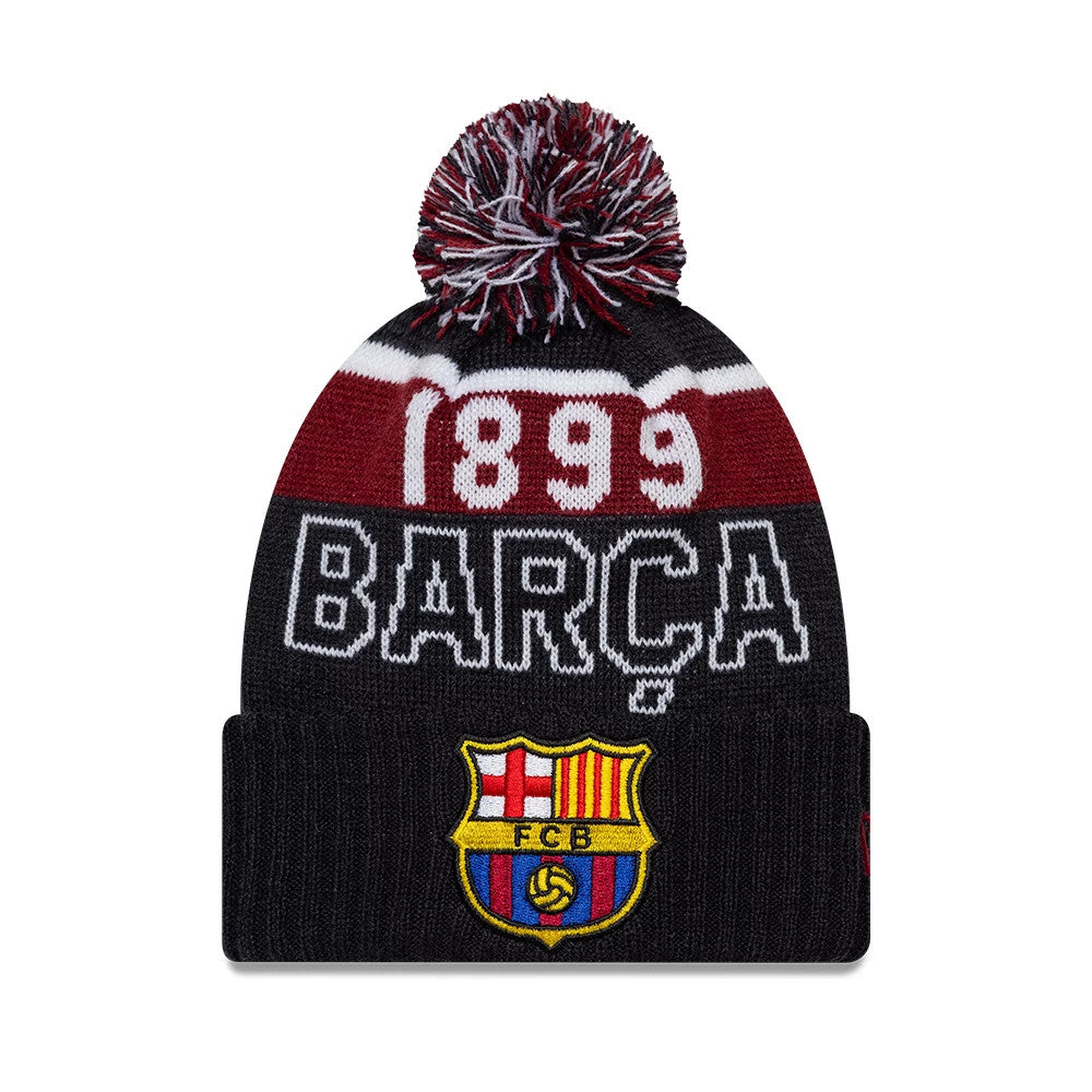 New Era FC Barcelona Youth Core Navy Sport knit Beanie Hat, front view showing the embroidered FC Barcelona crest on the navy cuff, white and maroon 'BARÇA' text above, and a navy, maroon, and white pom-pom on top.