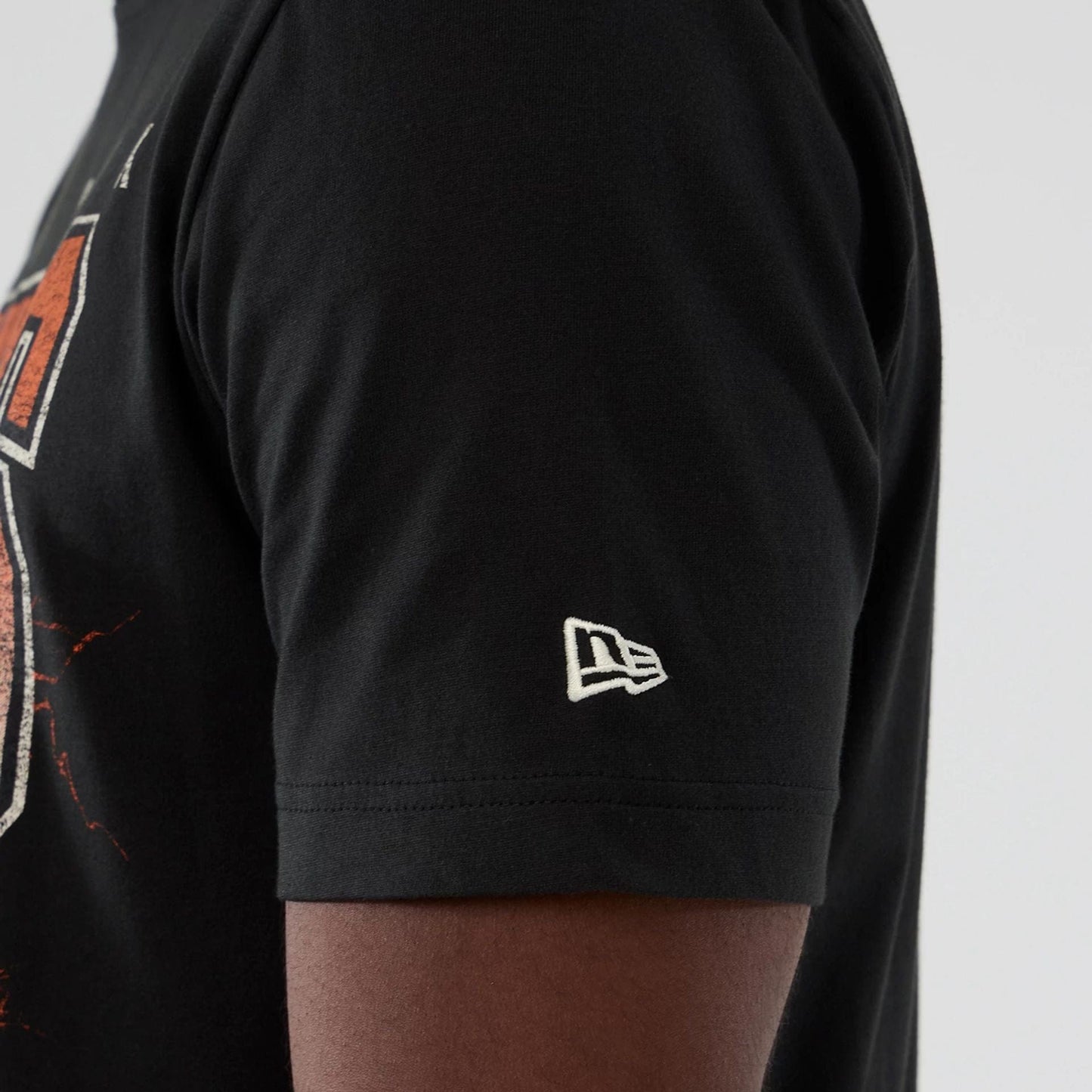 The model is wearing this NBA Hardwood Classic New York Knicks T-Shirt in black. 4