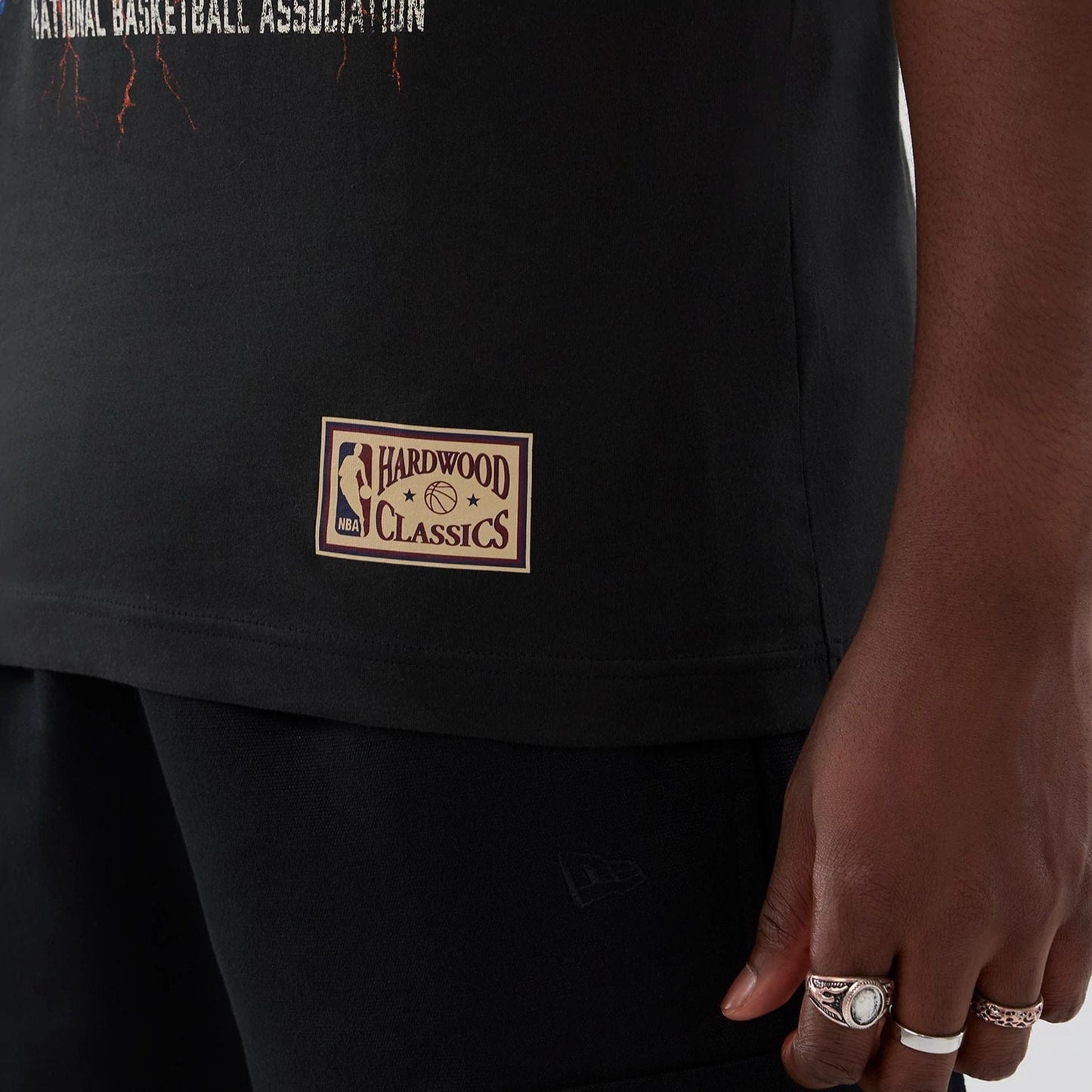 The model is wearing this NBA Hardwood Classic New York Knicks T-Shirt in black. 5