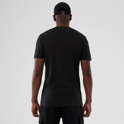 The model is wearing this NBA Hardwood Classic New York Knicks T-Shirt in black. 2