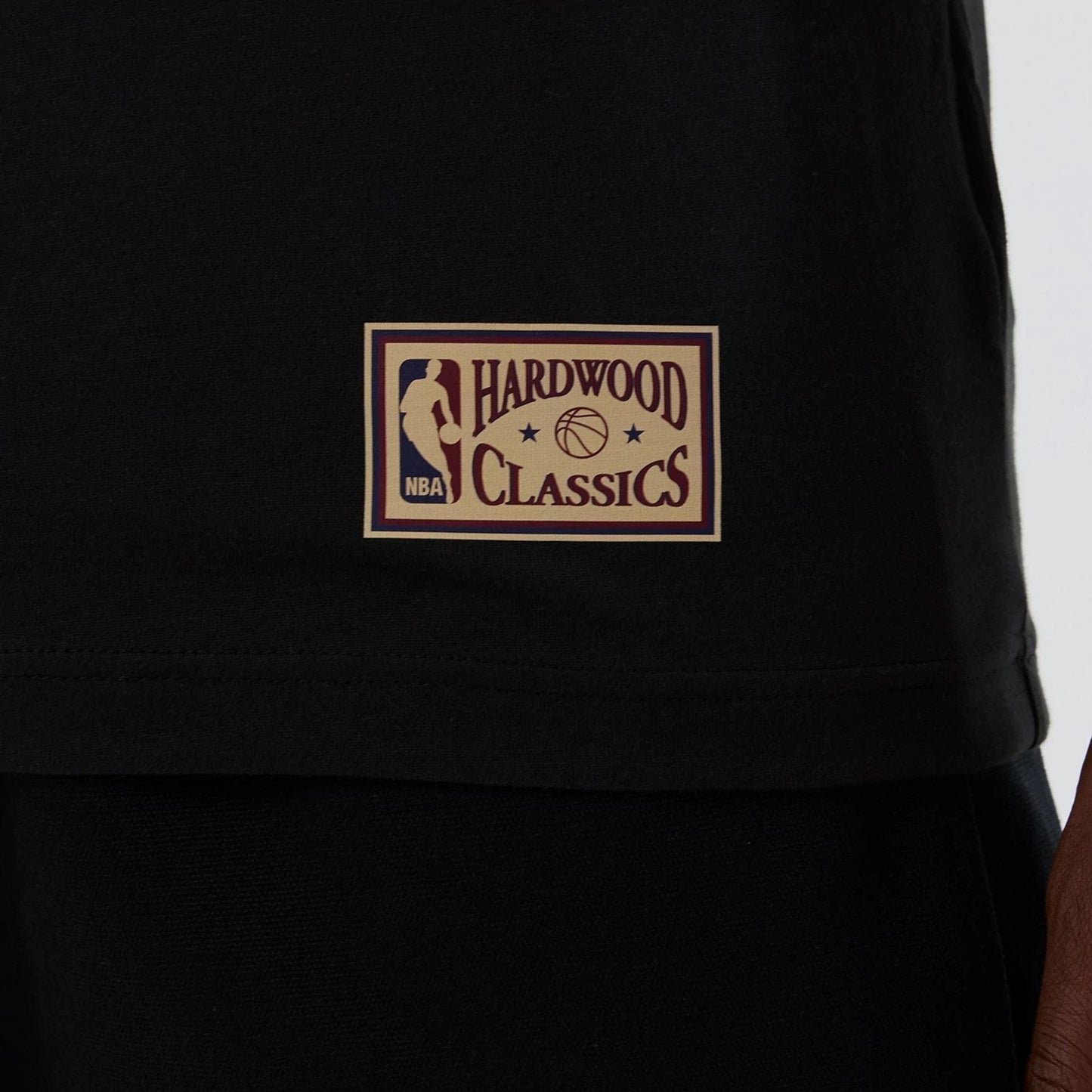 The model is wearing this NBA Hardwood Classic Boston Celtics T-Shirt in black. 5