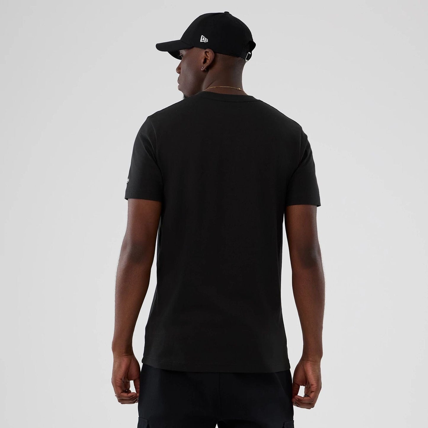 The model is wearing this NBA Hardwood Classic Boston Celtics T-Shirt in black. 2