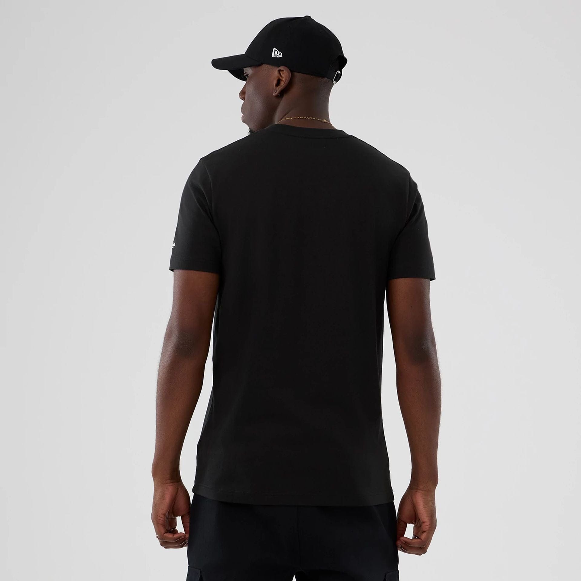 The model is wearing this NBA Hardwood Classic Boston Celtics T-Shirt in black. 2