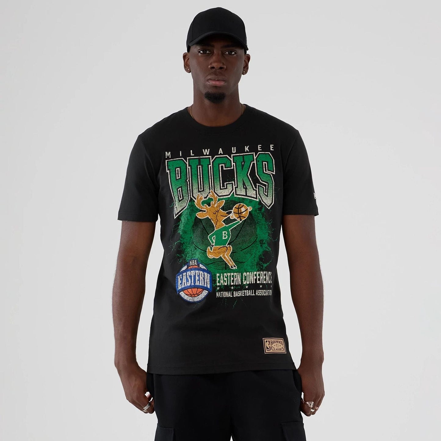The model is wearing this NBA Hardwood Classic Milwaukee Bucks T-Shirt in black. 1