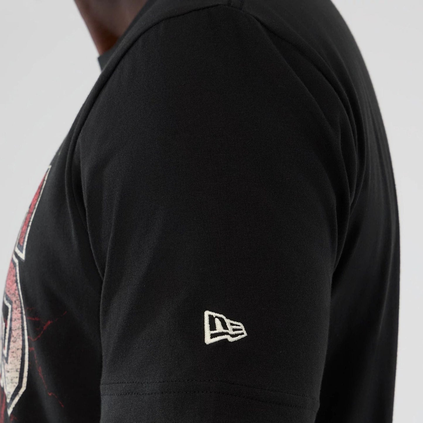 The model is wearing this NBA Hardwood Classic Detroit Pistons T-Shirt in black. 4