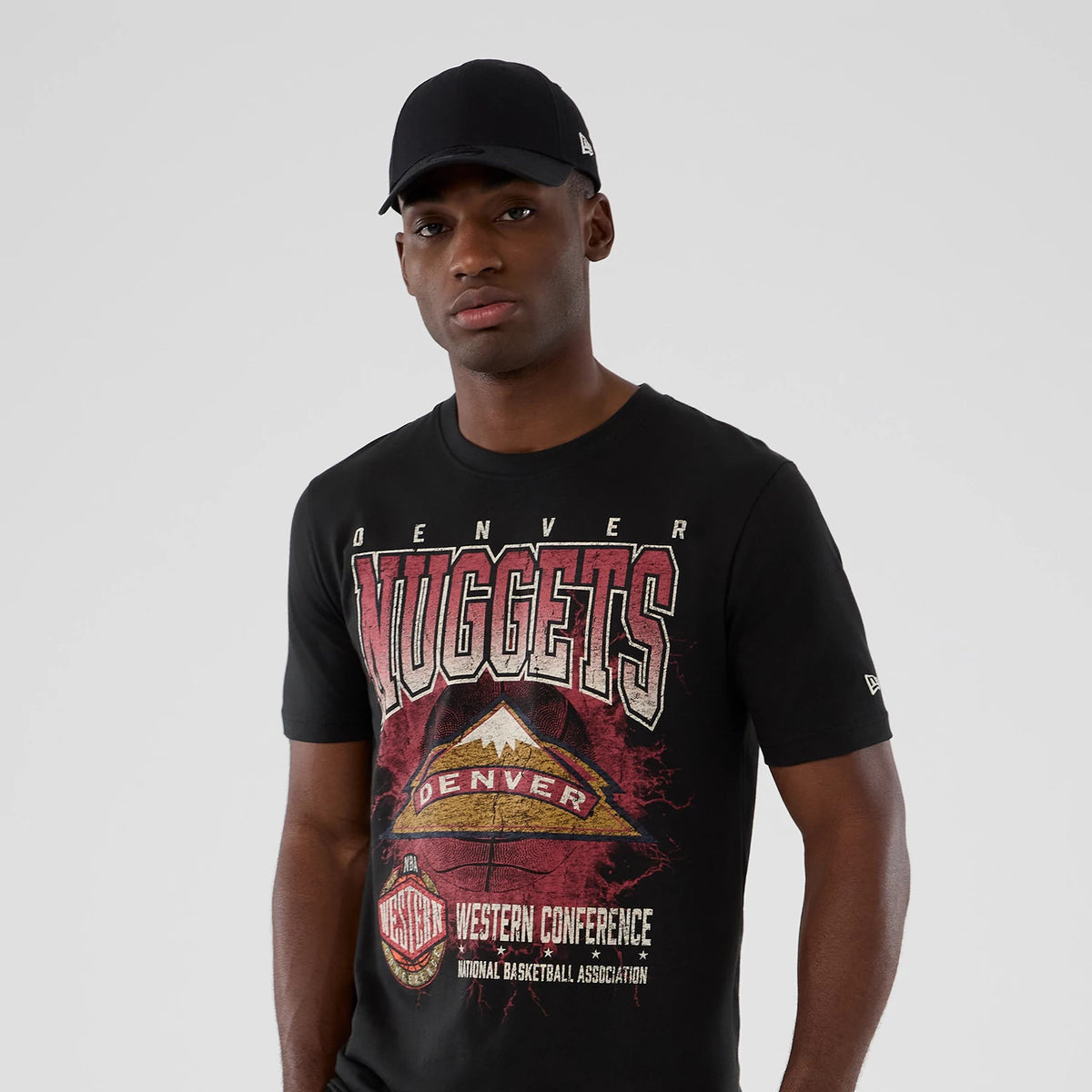 New Era Denver Nuggets NBA Hardwood Classic Black T-Shirt, front view on-model showing a large distressed Nuggets graphic with Denver lettering across the chest and a small embroidered New Era logo on the sleeve.