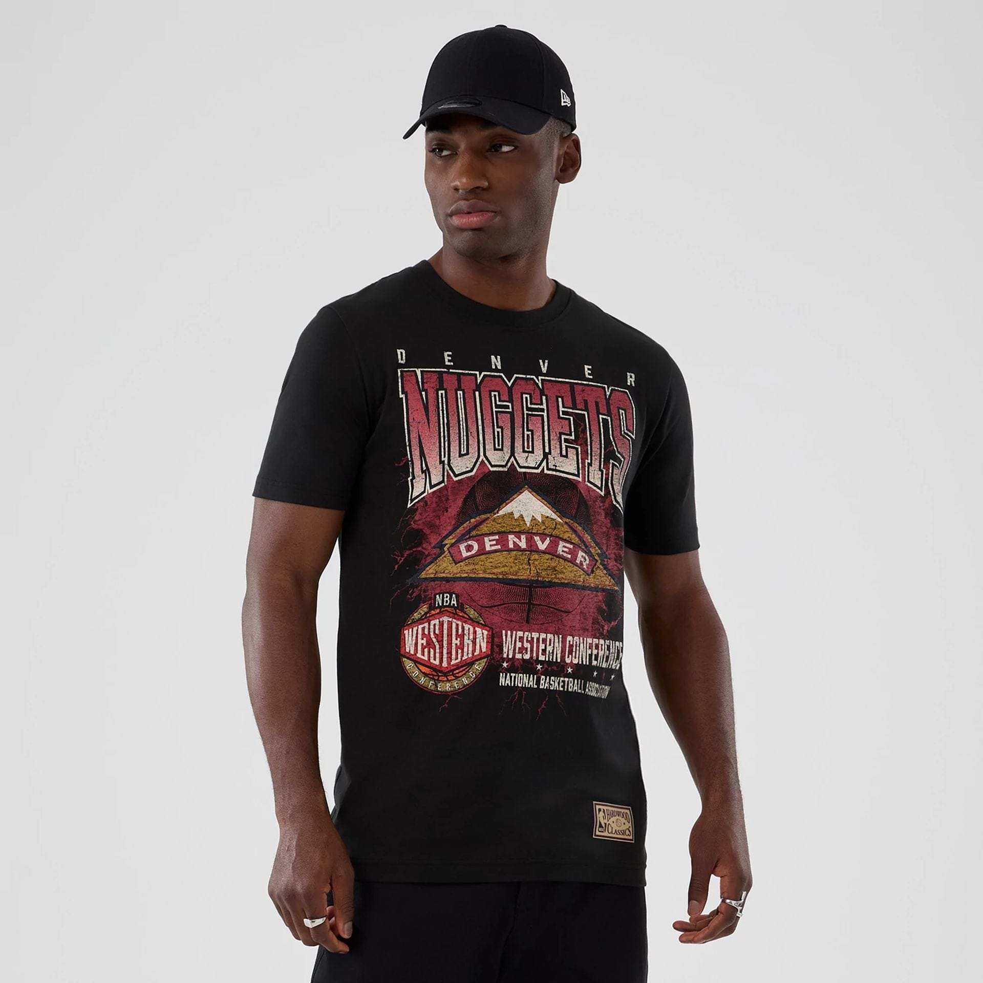 The model is wearing this NBA Hardwood Classic Denver Nuggets T-Shirt in black. 1