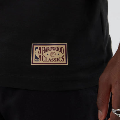 The model is wearing this NBA Hardwood Classic Dallas Mavericks T-Shirt in black. 5