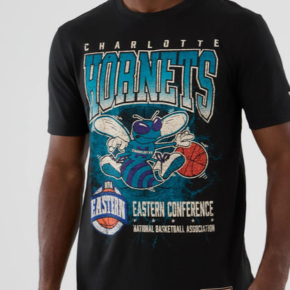 The model is wearing this NBA Hardwood Classic Charlotte Hornets T-Shirt in black. 3