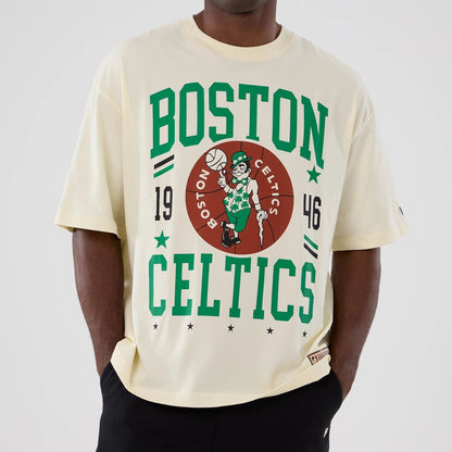 The model is wearing this NBA Hardwood Classic Boston Celtics T-Shirt in cream. 3
