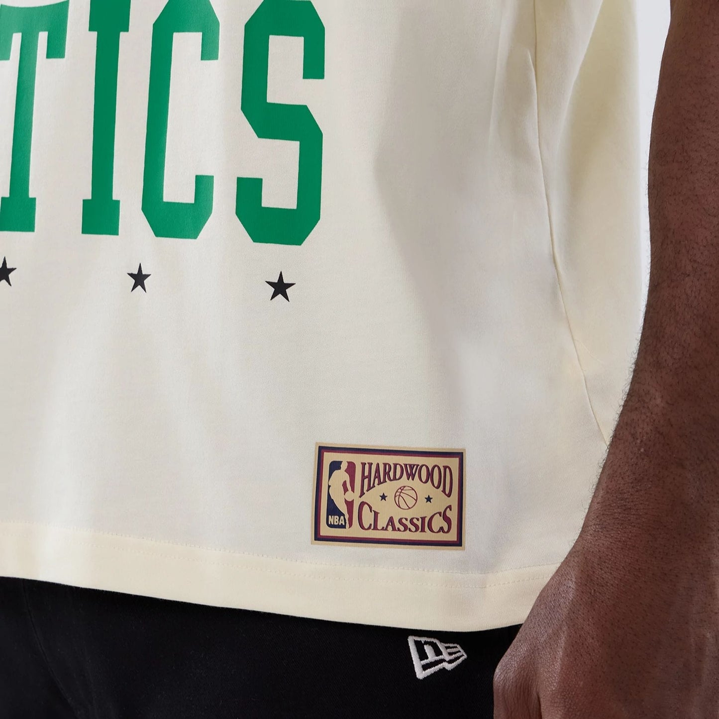 The model is wearing this NBA Hardwood Classic Boston Celtics T-Shirt in cream. 5