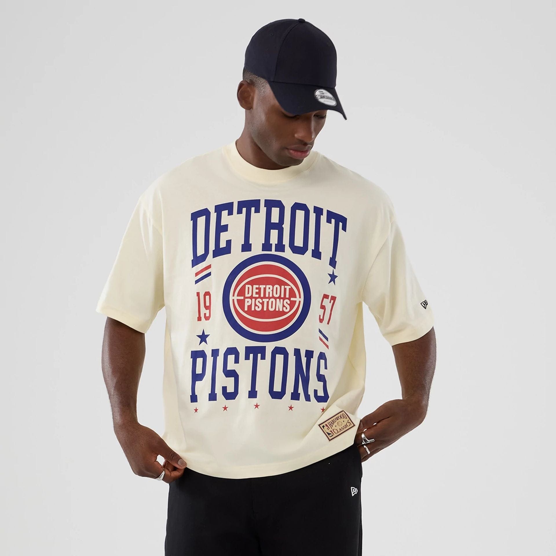 The model is wearing this NBA Hardwood Classic Detroit Pistons T-Shirt in cream. 7